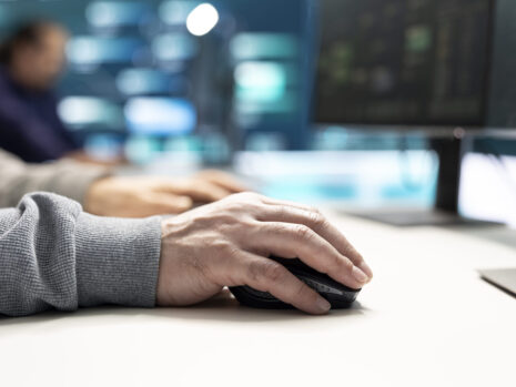Cyber security experts in governmental hacking room working on securing networks